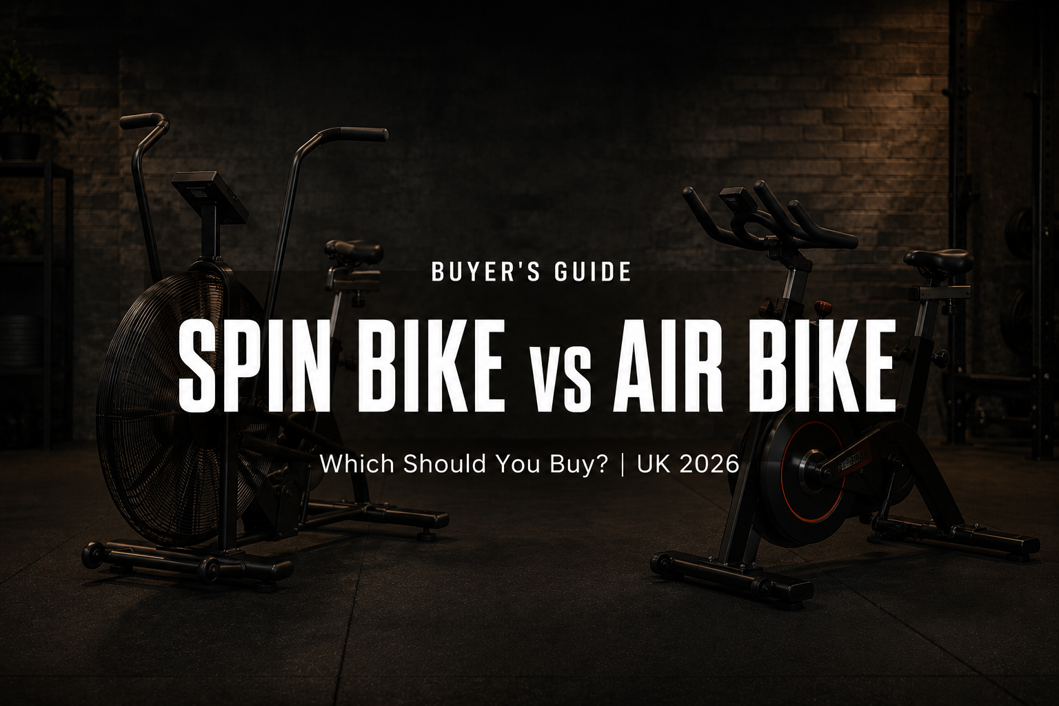 text: Premium black commercial air bike beside a black indoor spin bike on rubber flooring in a high-end home gym.