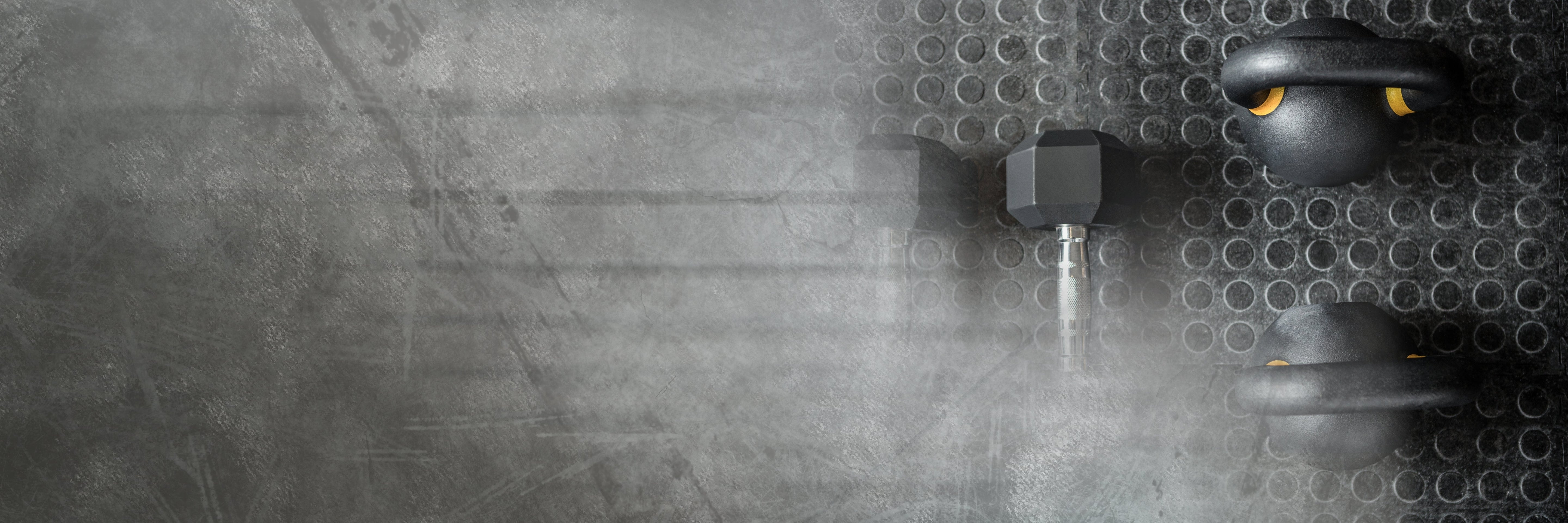 gym flooring Matts with dumbbells and barbells