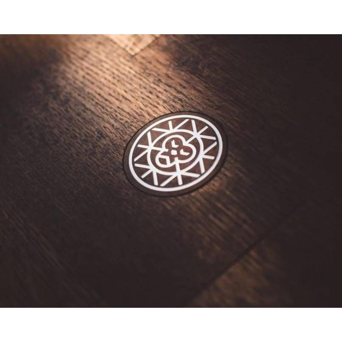 Brass monkey logo. Tree of lifestyle image with monkey face in the middle