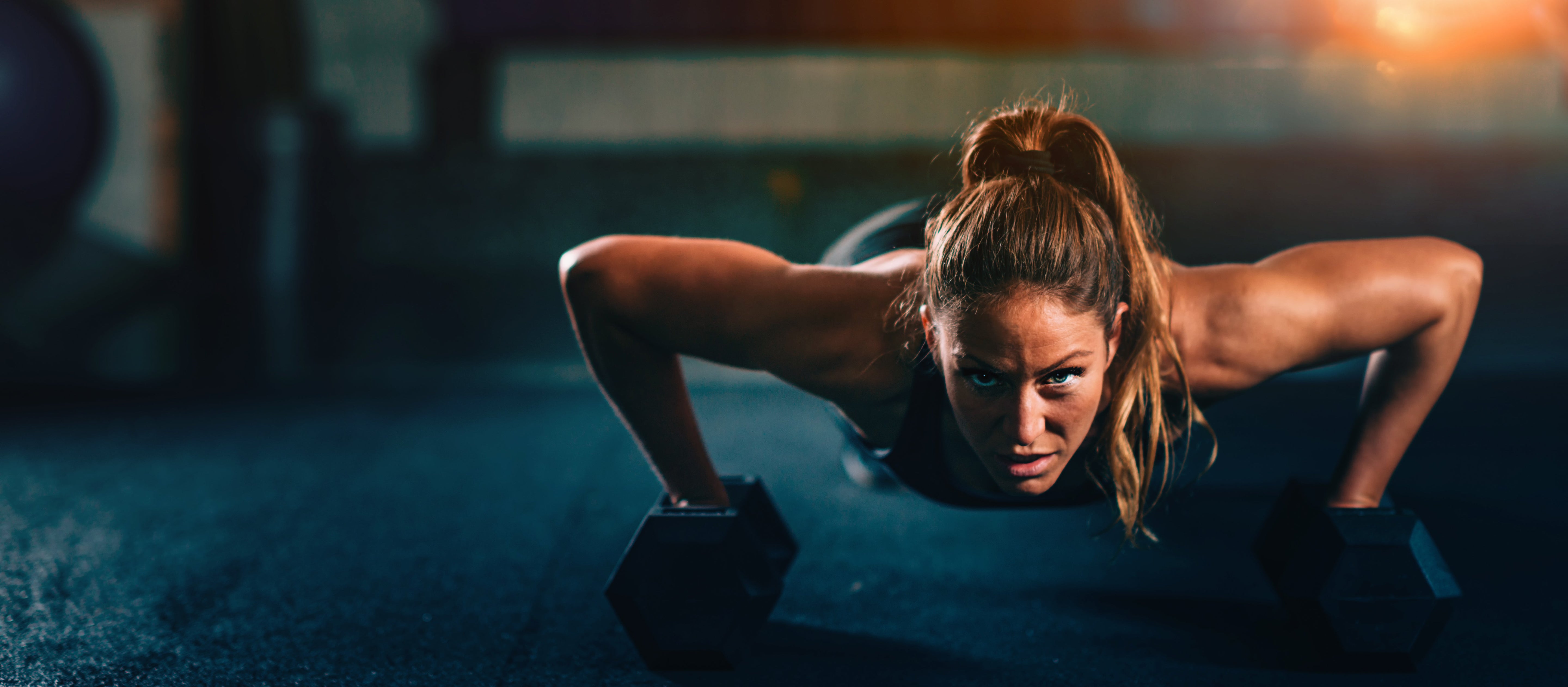 women doing press ups in the gym 