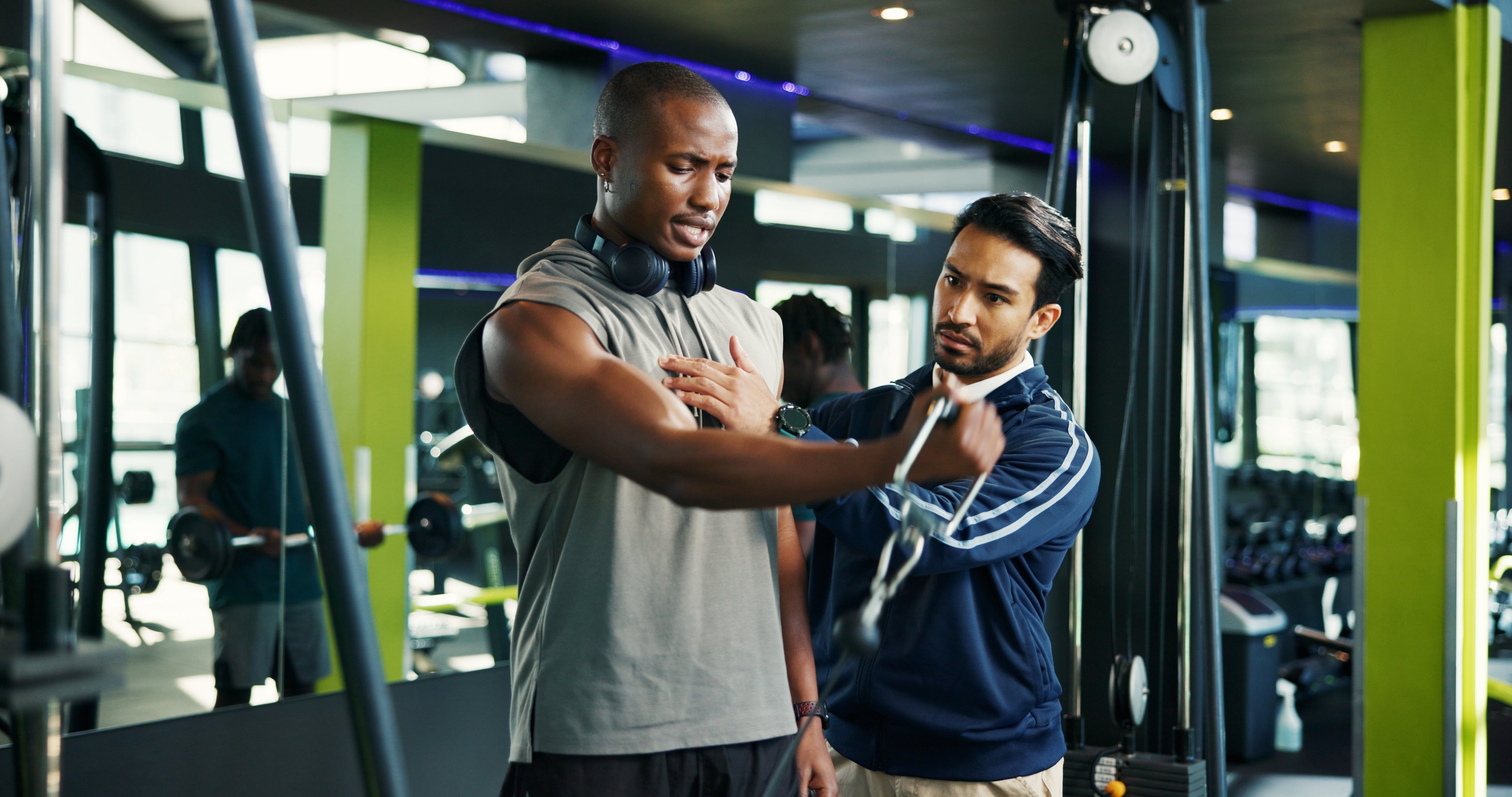 Two men using a multigym